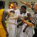 Ypsilanti senior Mamadou Ba shares words with Huron senior Jared Weeks and junior Demetrius Sims as the referee calls a technical foul against Ypsilanti during the first half at Huron on Thursday night.  Melanie Maxwell I AnnArbor.com